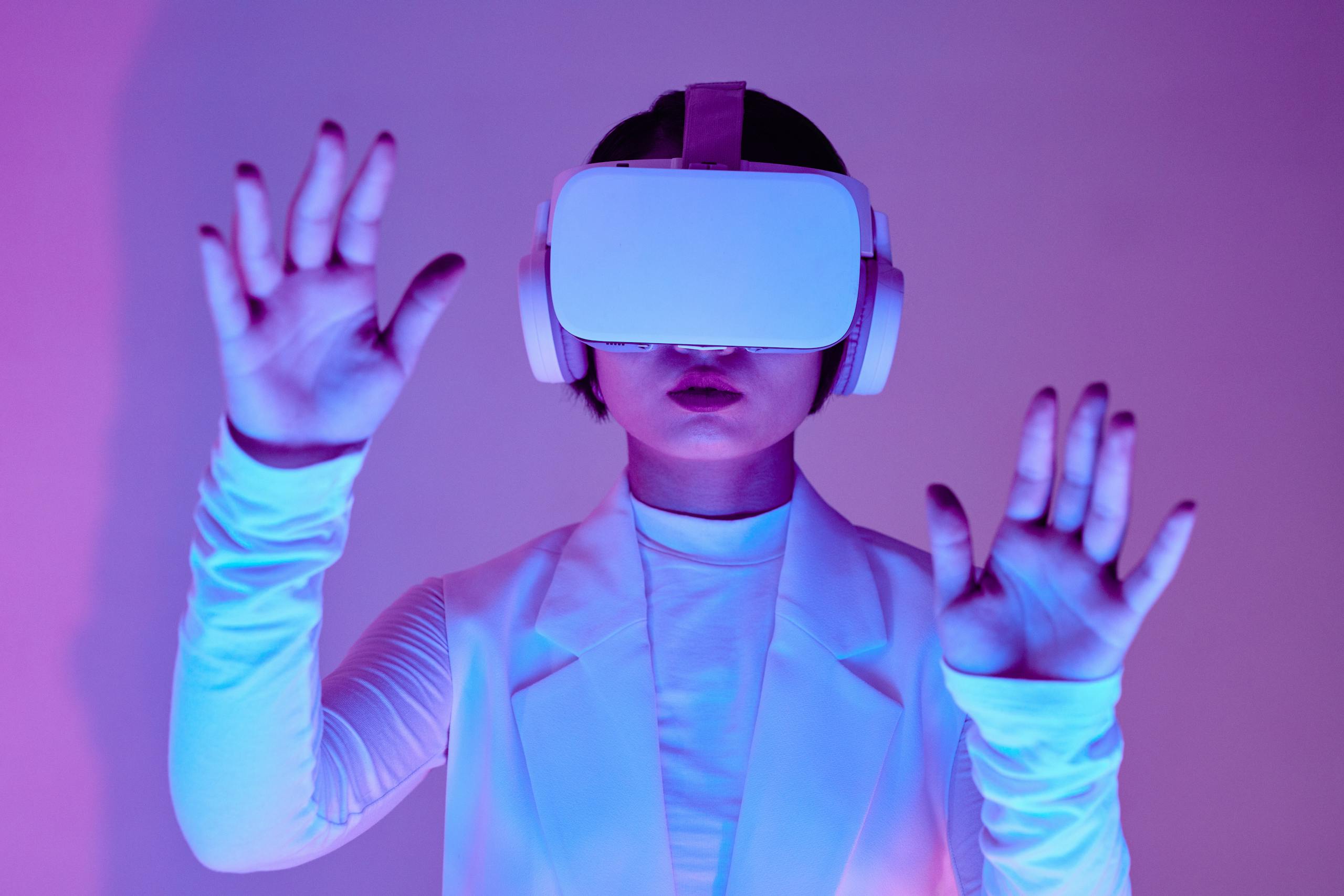 Woman in white long sleeves using virtual reality headset in a conceptual studio shoot.